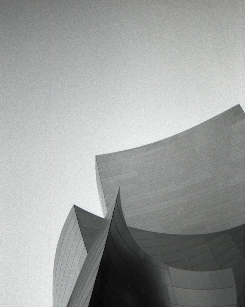 Abstract architectural structure with geometric shapes on a light gray background