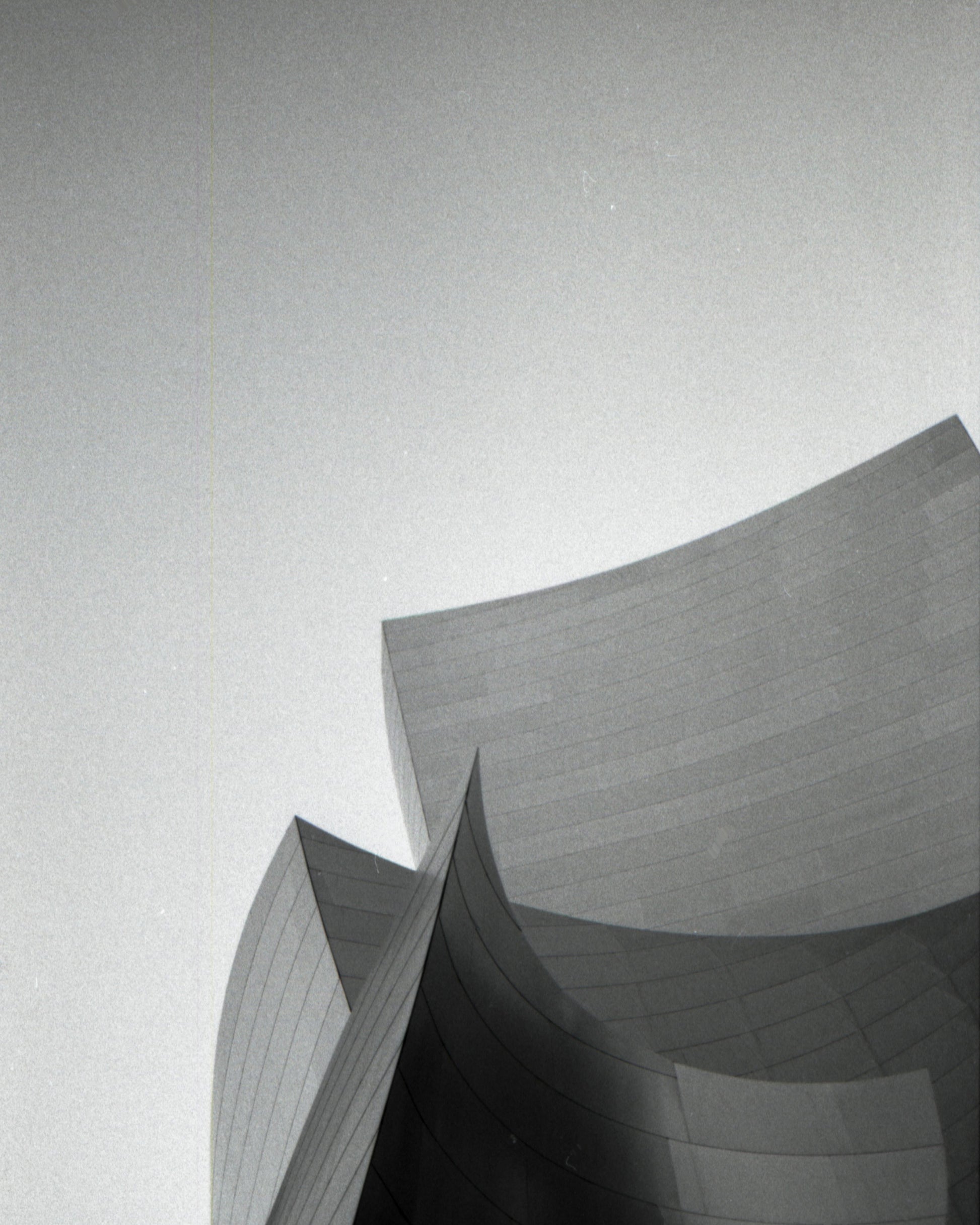 Abstract architectural structure with geometric shapes on a light gray background