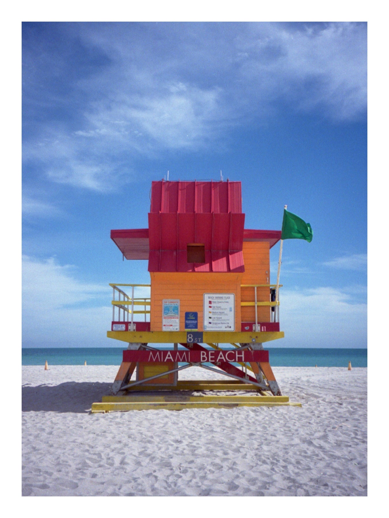 Colorful lifeguard tower on a beach with a clear blue sky. Miami Beach