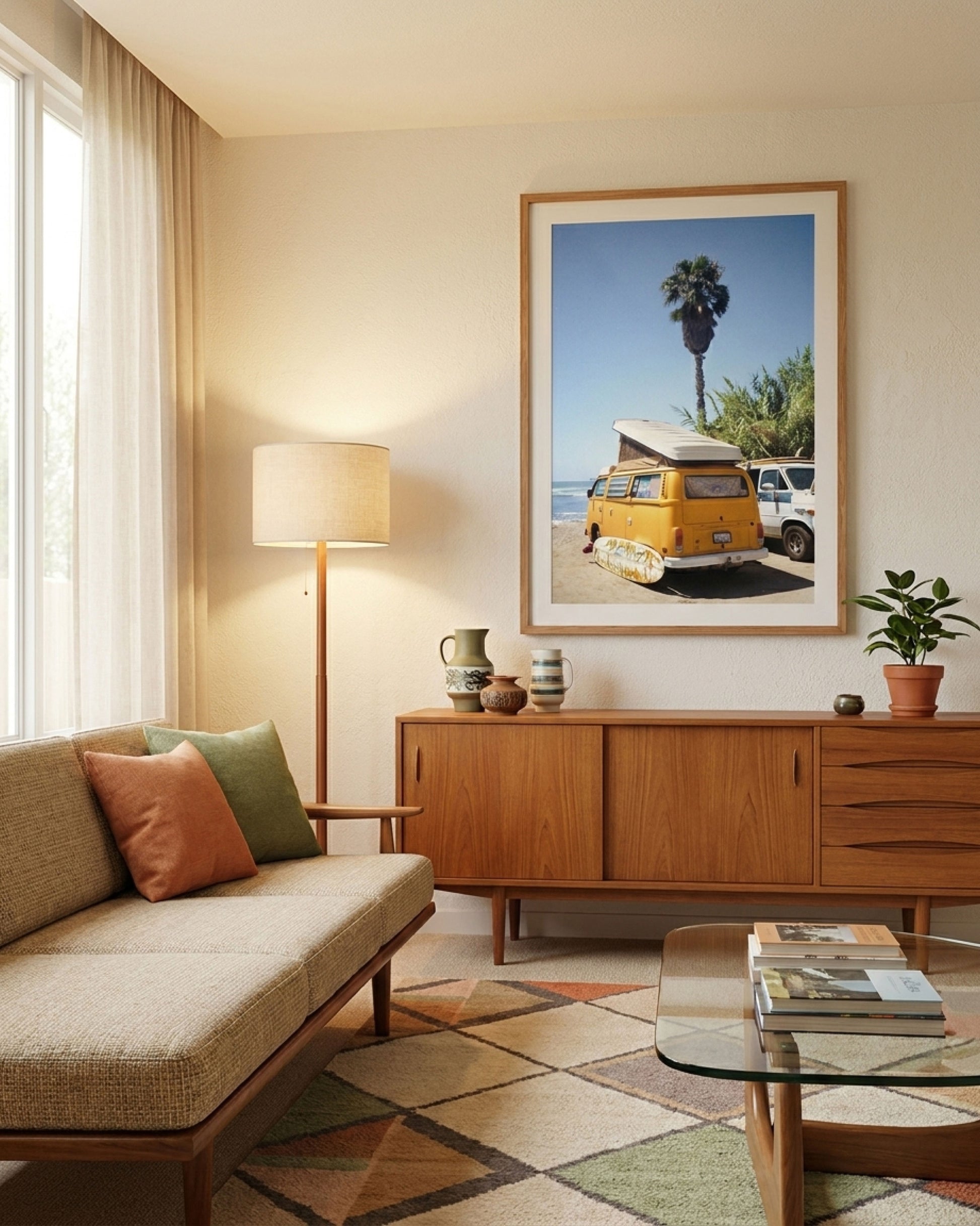 Living room with a couch, lamp, wooden sideboard, and framed picture of a van.
